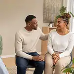 Four people representing distress, awareness, accepting support and recovery through addiction treatment